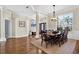 Formal dining room with hardwood floors and seating for eight at 17112 Downs Dr, Odessa, FL 33556