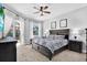 Main bedroom with a king-size bed, and sliding doors to the pool at 17112 Downs Dr, Odessa, FL 33556