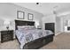 Main bedroom with king-size bed and access to the backyard at 17112 Downs Dr, Odessa, FL 33556