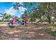 playground with slides, climbers, and play structures at 17112 Downs Dr, Odessa, FL 33556