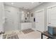 Modern bathroom with a glass shower, dual sinks, and a white vanity cabinet at 1920 E Idlewild Ave, Tampa, FL 33610