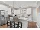 Bright kitchen with white cabinetry, granite countertops, and stainless steel appliances at 1920 E Idlewild Ave, Tampa, FL 33610