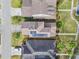 Aerial view of rooftops, solar panels, landscaping and neighborhood streets at 20033 Heritage Point Dr, Tampa, FL 33647