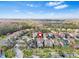 Neighborhood aerial view of trees, landscaped yards, and cul-de-sac street at 20033 Heritage Point Dr, Tampa, FL 33647