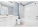 A well-lit bathroom with a tub, toilet and sink at 20033 Heritage Point Dr, Tampa, FL 33647