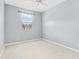 A light blue bedroom with a window and fan at 20033 Heritage Point Dr, Tampa, FL 33647