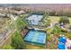 Aerial view of community tennis and pickleball courts surrounded by lush landscaping and sidewalks at 20033 Heritage Point Dr, Tampa, FL 33647