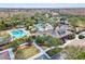 Community pool and clubhouse aerial with mature palm trees at 20033 Heritage Point Dr, Tampa, FL 33647