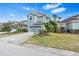 Well-maintained single-Gathering home with a three-car garage and lush landscaping at 20033 Heritage Point Dr, Tampa, FL 33647