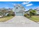 Beautiful home with a two-car garage and a well-manicured front lawn creates an appealing curb appeal at 20033 Heritage Point Dr, Tampa, FL 33647