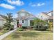 Charming two-story home with well-maintained landscaping and a welcoming front yard on a sunny day at 20033 Heritage Point Dr, Tampa, FL 33647