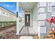 Inviting front entrance with a decorative door, manicured plants, and well lit walkway at 20033 Heritage Point Dr, Tampa, FL 33647