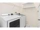 Functional laundry room equipped with a washer and dryer for convenient laundry care at 20033 Heritage Point Dr, Tampa, FL 33647