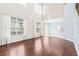Spacious living room with high ceilings, large windows, and hardwood flooring provides abundant natural light at 20033 Heritage Point Dr, Tampa, FL 33647