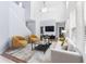 Bright living room with high ceilings, modern furniture, and hardwood floors creates an inviting space at 20033 Heritage Point Dr, Tampa, FL 33647