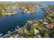 Stunning aerial view showcasing waterfront homes, private docks, and lush landscaping on a sunny day at 210 22Nd Ne Ave # 14, St Petersburg, FL 33704