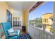 Inviting balcony with terracotta tile, vibrant rug, comfortable chair, and an attractive view at 210 22Nd Ne Ave # 14, St Petersburg, FL 33704