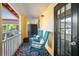 Charming balcony with chairs, patterned rug, and sunny views at 210 22Nd Ne Ave # 14, St Petersburg, FL 33704