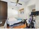 Bedroom with hardwood floors, natural light, and exercise equipment at 210 22Nd Ne Ave # 14, St Petersburg, FL 33704