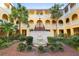 Charming courtyard with fountain and lush greenery, enhancing the Mediterranean ambiance at 210 22Nd Ne Ave # 14, St Petersburg, FL 33704