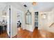 Hallway with hardwood floors and ornate mirror, connecting bedrooms and storage at 210 22Nd Ne Ave # 14, St Petersburg, FL 33704