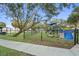 A fenced playground area with play equipment for children ages 5-12 at a City of St. Petersburg park at 210 22Nd Ne Ave # 14, St Petersburg, FL 33704