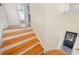 Bright staircase with hardwood steps leading to the front door and upper level at 210 22Nd Ne Ave # 14, St Petersburg, FL 33704