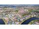 Aerial view showcasing homes and a lake in a residential community at 26848 Shoregrass Dr, Wesley Chapel, FL 33544