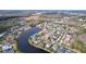 Aerial view of a residential community with lake at 26848 Shoregrass Dr, Wesley Chapel, FL 33544