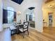 Elegant dining room featuring hardwood floors and a beautiful chandelier at 26848 Shoregrass Dr, Wesley Chapel, FL 33544