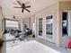 Relaxing screened porch with lake view and patio furniture at 26848 Shoregrass Dr, Wesley Chapel, FL 33544