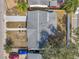 Overhead view of a house with a gray roof and a small yard at 2904 Matchlock Dr, Holiday, FL 34690