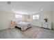 Spacious bedroom with light flooring and ample natural light at 2904 Matchlock Dr, Holiday, FL 34690