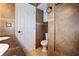 Bathroom featuring vanity, toilet, tiled walls, and a storage cabinet offering ample space and modern fixtures at 3087 Duane Ave, Oldsmar, FL 34677