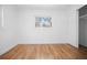 Bedroom featuring wood floors, neutral decor, a closet and one window providing natural light at 3087 Duane Ave, Oldsmar, FL 34677