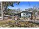 Charming single-story home with a beautifully landscaped front yard and inviting outdoor seating area at 3087 Duane Ave, Oldsmar, FL 34677