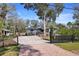 Charming single-story home featuring a gravel driveway and fenced yard, creating an inviting curb appeal at 3087 Duane Ave, Oldsmar, FL 34677