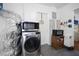 Laundry area with modern appliances and storage, located off of the kitchen at 3087 Duane Ave, Oldsmar, FL 34677