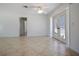 Bright and open living room with tiled floors and French doors to patio at 3087 Duane Ave, Oldsmar, FL 34677