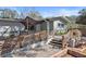 A covered front porch with wooden lattice and steps, offering a welcoming entrance at 3087 Duane Ave, Oldsmar, FL 34677