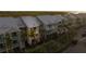 Aerial view of townhome community, with lush landscaping and convenient parking at 3244 Mangrove Point Dr, Ruskin, FL 33570