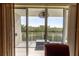 Balcony view, highlighting its access from the main living area and the serene mangrove scenery for peaceful outdoor enjoyment at 3244 Mangrove Point Dr, Ruskin, FL 33570