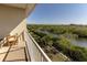 Relax on this balcony with views of the lush landscape and tranquil waterway at 3244 Mangrove Point Dr, Ruskin, FL 33570