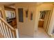 Hallway with access to the kitchen and the bathroom, featuring elegant wall decor at 3244 Mangrove Point Dr, Ruskin, FL 33570