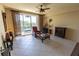 Bright living room featuring tile flooring, stylish furnishings, and a sliding door to a private balcony with lovely outdoor views at 3244 Mangrove Point Dr, Ruskin, FL 33570