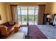 Bright main bedroom with balcony and stylish furnishings at 3244 Mangrove Point Dr, Ruskin, FL 33570