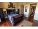 Well-furnished main bedroom with elegant dark wood furniture at 3244 Mangrove Point Dr, Ruskin, FL 33570