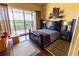 Bright main bedroom featuring a balcony overlooking lush greenery and stylish furnishings at 3244 Mangrove Point Dr, Ruskin, FL 33570