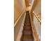 Carpeted stairway leading up with white railings, and a view of upper-level landing at 3244 Mangrove Point Dr, Ruskin, FL 33570