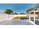 Fully fenced backyard with grass and landscaping at 3350 Brookfield Dr, Holiday, FL 34691